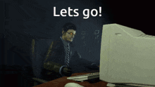 a computer screen says let 's go with a man in a suit and tie