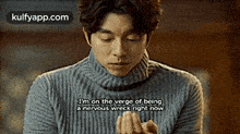 a man in a turtleneck sweater is talking about being nervous right now .