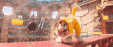 a cartoon character wearing a yellow cat costume is playing a game