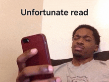 a man is looking at his cell phone with the words unfortunate read above him