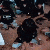 a group of people are sitting on the floor dancing together .