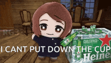 a stuffed doll is standing next to a box of heineken