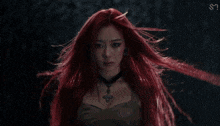 a woman with long red hair is wearing a choker and a butterfly necklace