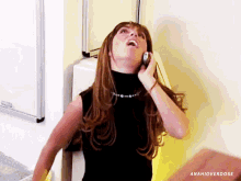 a woman is talking on a cell phone with the hashtag anahioverdose below her