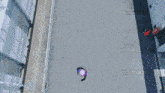 an aerial view of a purple and blue explosion