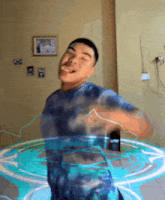 a man in a tie dye shirt is standing in a room