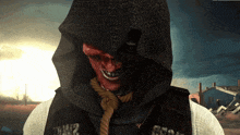 a grim reaper with a rope around his neck and a hood