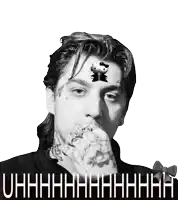 a black and white photo of a man with a hello kitty on his forehead