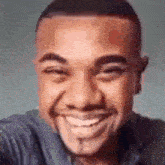 a close up of a man 's face with a smile on it .