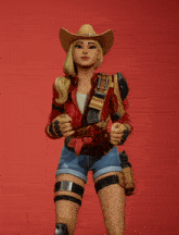 a woman in a cowboy hat is holding her arms up