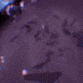 a purple avengers logo with a lightning bolt in the background