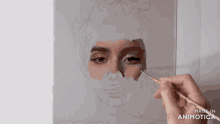 a person is painting a woman 's face with a brush and the words made in animatica are visible