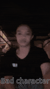 a girl is standing under a bunk bed with the words bad character written on the bottom