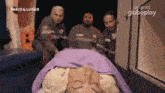 a woman is laying in an ambulance with pablo & luisao written on the bottom right