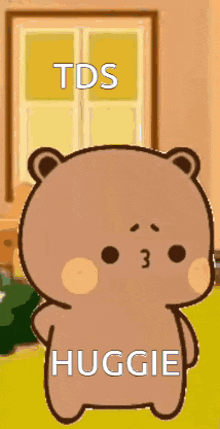 a cartoon teddy bear is standing in front of a window with the words tds huggies written on it .