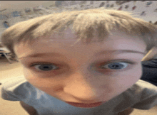 a close up of a person 's face with their eyes wide open .