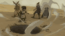 a group of people are standing around a rock in the desert .