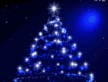 a blue christmas tree with a star in the top