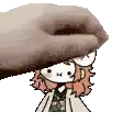 a hand is holding a cartoon character 's head in a pixelated image .