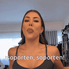 a woman in a black tank top says isporten