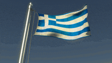 a blue white and yellow greek flag is flying in the wind