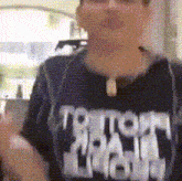 a person wearing a black shirt that says ' storm chasers '