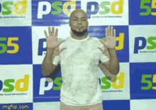 a bald man with a beard is giving a high five in front of a banner that says psd .