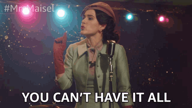 a woman singing into a microphone with the words you can 't have it all