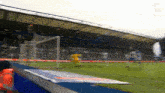 a blurry picture of a soccer field with a banner that says ' allianz '
