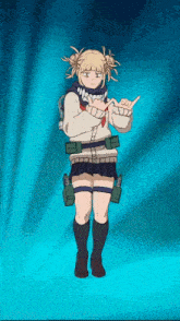 a girl in a school uniform is standing in front of a blue curtain and giving a thumbs up .