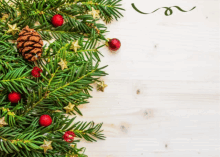 a christmas tree with a pine cone and red and gold ornaments