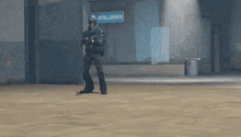 a man in a blue hat is holding a sniper rifle in his hand