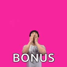a man is standing in front of a pink background with the words happy mother 's day bonus