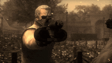 a man holding a gun with the letter s in the lower right corner