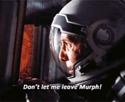 a man wearing a helmet says 