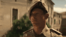 a man in a military uniform has a badge on his hat that says ' u.s. army '