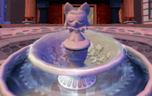a fountain with a statue of a cat in it