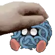 a hand is petting a cartoon character that looks like spaghetti .