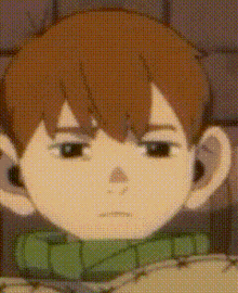 a close up of a person 's face with a green scarf around their neck