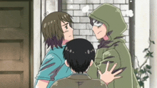 a man in a green hooded jacket stands between two other men
