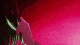 a person 's face is glowing in the dark against a pink background .