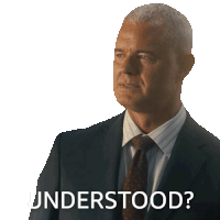 a man in a suit and tie has the word understood written on his face