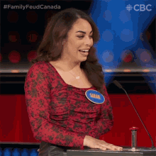 a woman with a name tag that says " sarah " on it