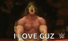 a shirtless wrestler is sitting in a ring with his mouth open and says `` i love g u z '' .
