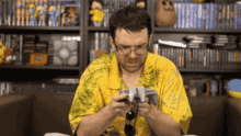 a man in a yellow shirt is playing a game