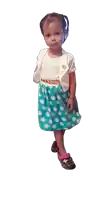 a little girl wearing a polka dot skirt and a white top