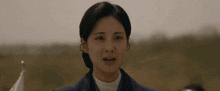a close up of a woman making a funny face