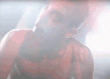 a close up of a woman 's face with smoke coming out of her mouth