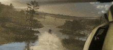 a person is riding a jet ski through a river