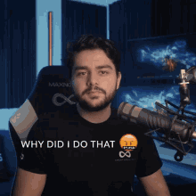 a man sitting in front of a microphone with the words " why did i do that " below him